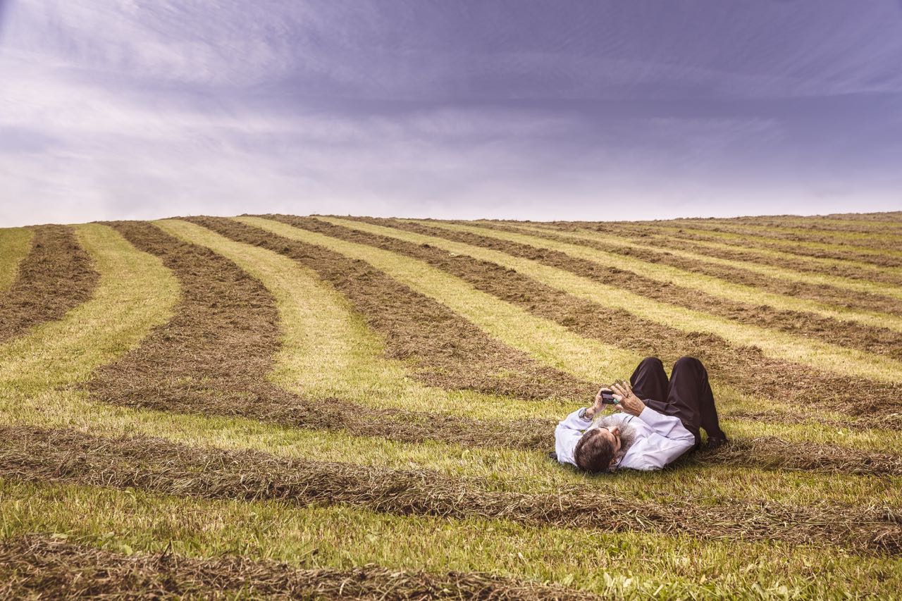 man lying in a field